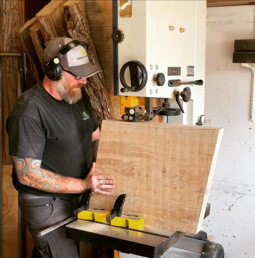 Tom Charters using a bandsaw